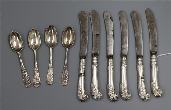 A set of six George V silver pistol handled fruit knives, a set of four unmarked lace back teaspoons.